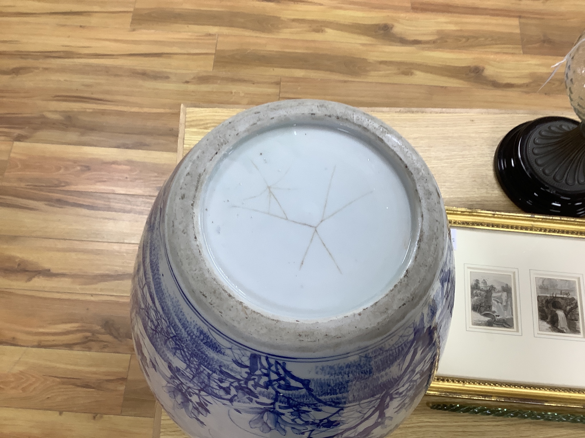 A large Japanese blue and white vase decorated with foliage and birds, 49cms high